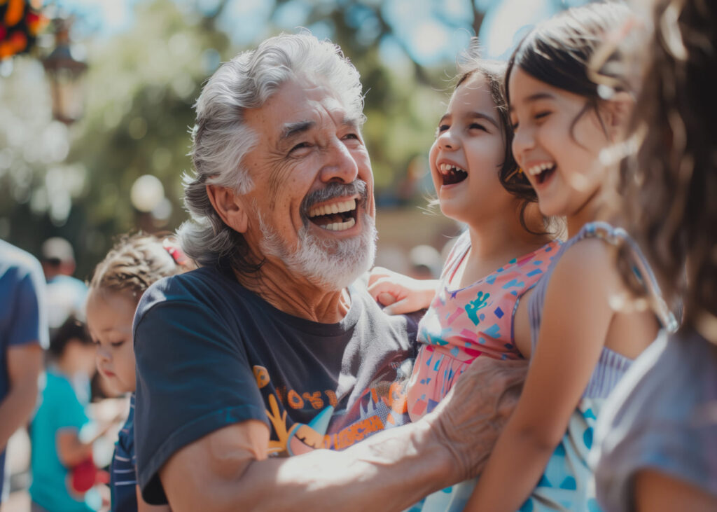 abuelo-que-abraza-a-sus-nietas-mientras-rien